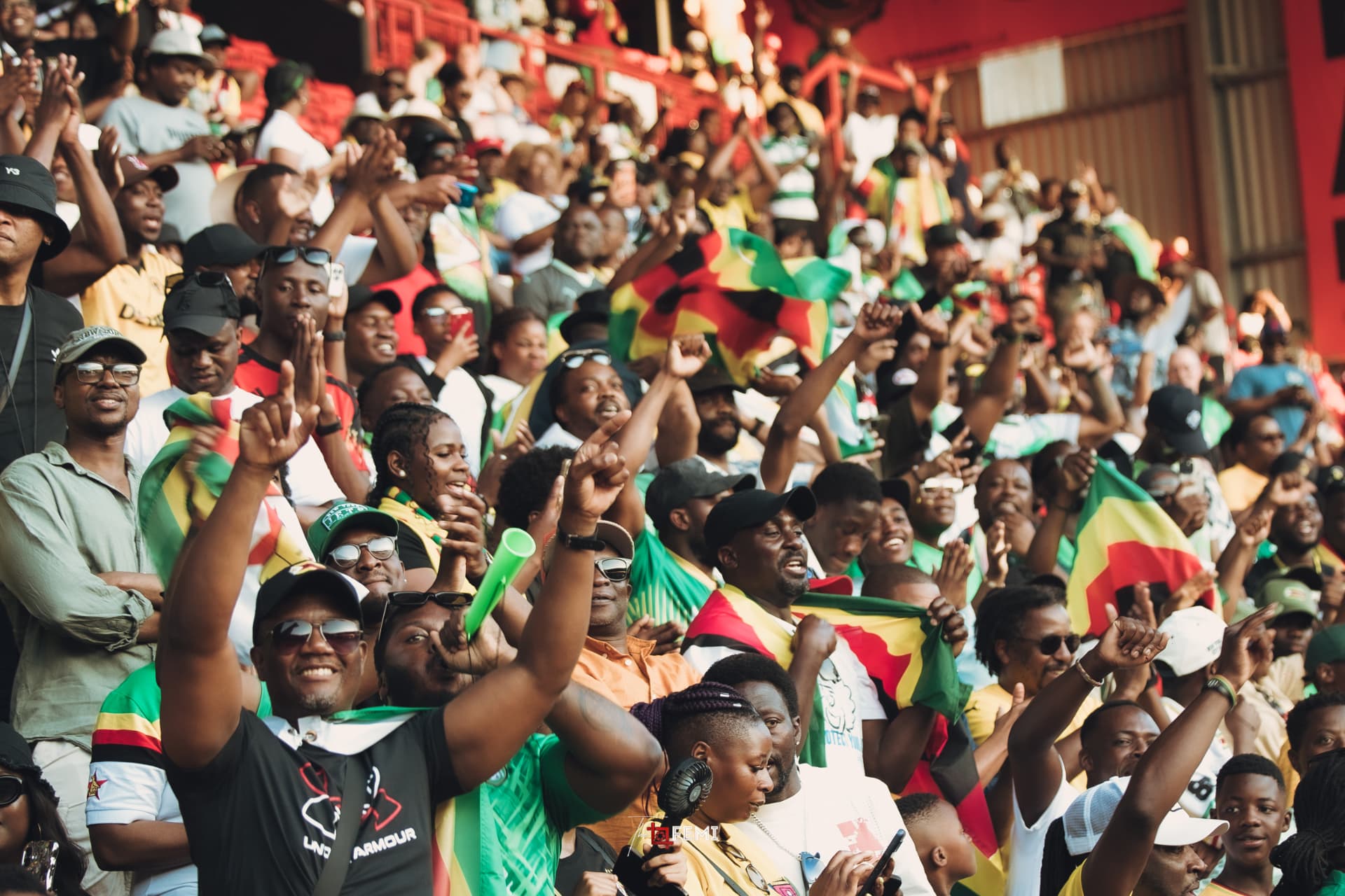 Zimbabwean fans in flags cheering in the stands at Unity Cup 2026